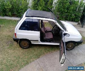 MAZDA 121 FUNTOP 1989 WITH ELECTRIC SUNROOF (VERY RARE)