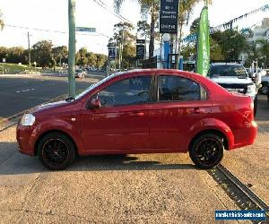 2009 Holden Barina TK Red Automatic A Sedan