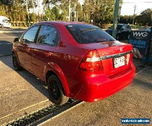 2009 Holden Barina TK Red Automatic A Sedan