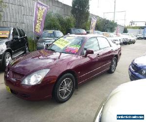 2003 Mitsubishi Magna TJ Sports Red Automatic 5sp A Sedan