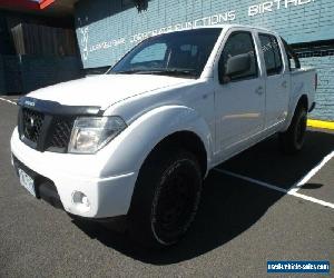 2009 Nissan Navara D40 ST (4x4) White Manual 6sp M Dual Cab Pick-up