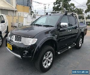 2014 Mitsubishi Triton MN GLX-R Utility Double Cab 4dr Auto 5sp 4x4 2.5DT Black