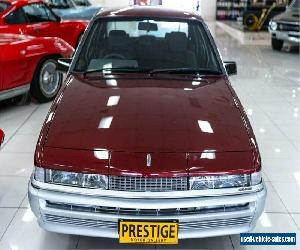 1986 Holden Commodore VL SL Burgundy Manual 5sp M Sedan