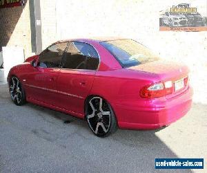 2002 Holden Calais VX Pink Automatic 4sp A Sedan