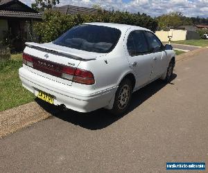 Nissan Maxima, 1997 V6 Auto, PEARL WHITE, (MOTOR HAS CRACKED HEAD & WON'T RUN)