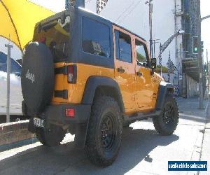 2012 Jeep Wrangler Unlimited JK MY13 Sport (4x4) Orange Automatic 5sp A Softtop