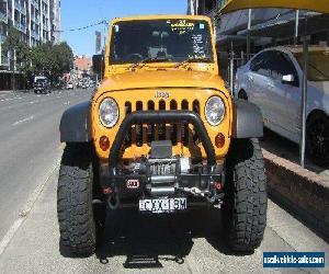 2012 Jeep Wrangler Unlimited JK MY13 Sport (4x4) Orange Automatic 5sp A Softtop