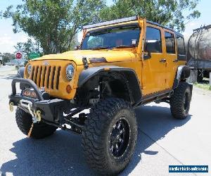 2012 Jeep Wrangler JK MY2012 Unlimited Sport Orange Manual 6sp M Softtop