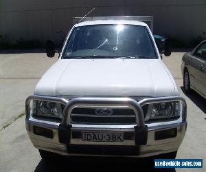 FORD COURIER TWIN CAB 05/2004 TURBO DIESEL 4WD STEER AND AIR TABLETOP WITH SIDES