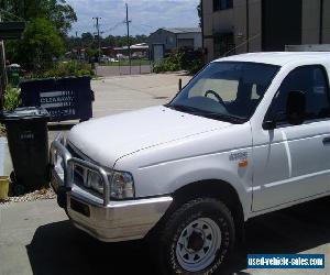 FORD COURIER TWIN CAB 05/2004 TURBO DIESEL 4WD STEER AND AIR TABLETOP WITH SIDES