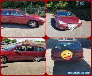 Burgundy Ford Focus Zetec estate car