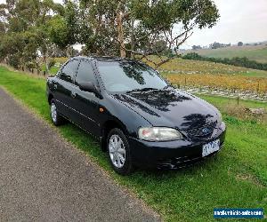 1998 Ford Laser LXI Sedan. 1.6L AUTO 152k RWC REGO