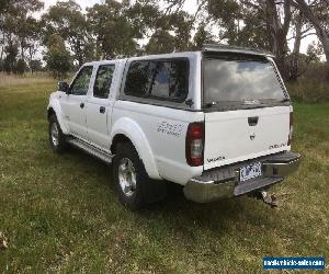 2010 NAVARA D22 STR TWIN CAB UTE WITH CANOPY