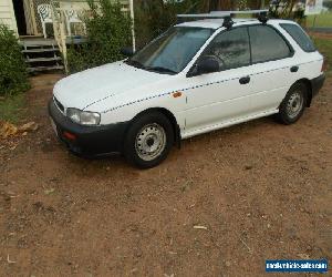 1997 Subaru Impreza Model "G" 5 Door Hatch, 4 Speed Auto, Air &Power Steering.