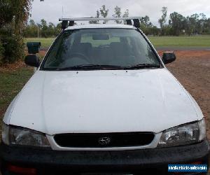 1997 Subaru Impreza Model "G" 5 Door Hatch, 4 Speed Auto, Air &Power Steering.