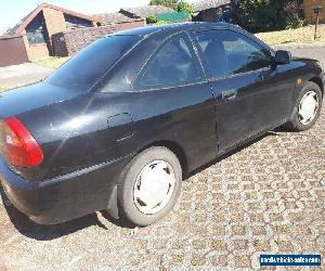 2002 BLACK MITSUBISHI COUPE