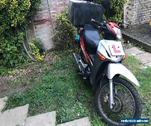 Honda innova 125 ANF with long mot plus delivery top box