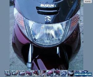 Suzuki Burgman AN400 Maroon. Under 10,000 miles Low reserve. Private sale.