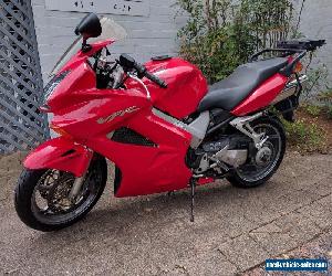 Red Honda VFR800Fi 2004 with OEM Topbox and Panniers