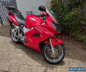 Red Honda VFR800Fi 2004 with OEM Topbox and Panniers